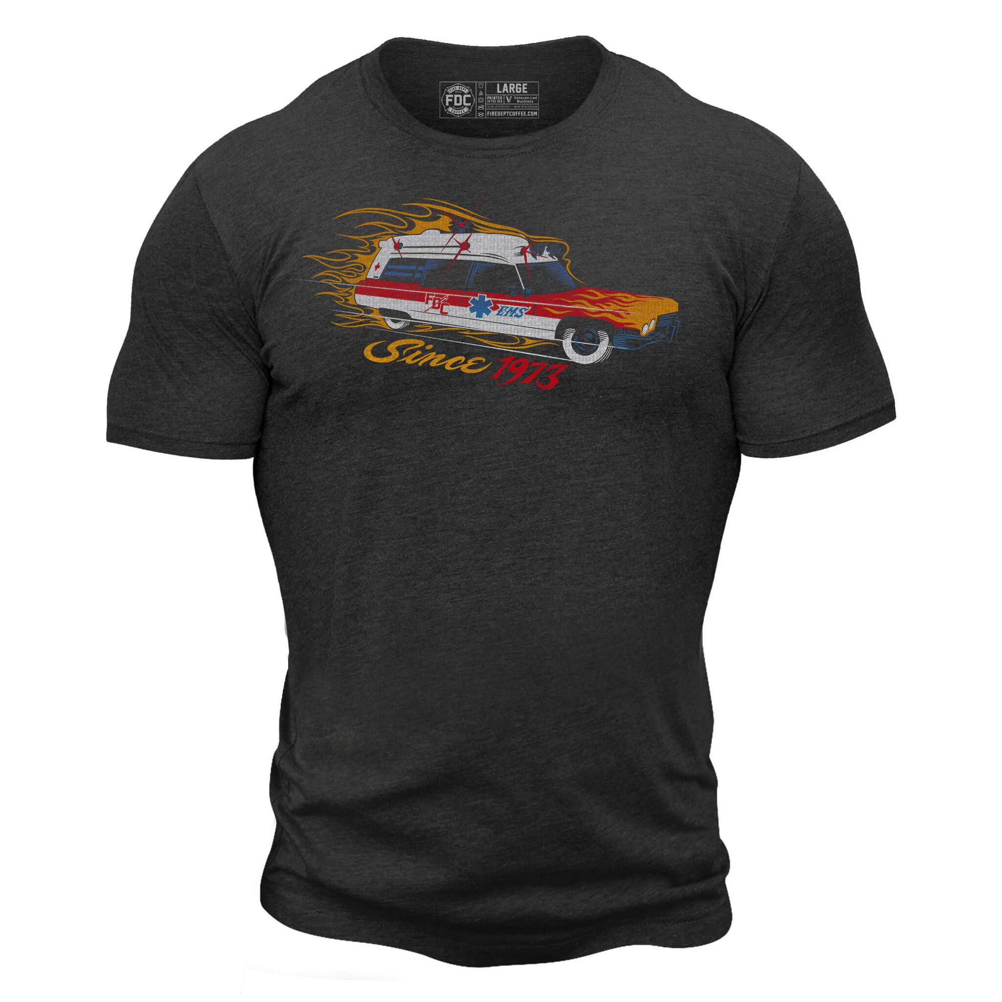 A dark gray t shirt with a "meat wagon" vehicle on the chest surrounded by flames. Under the vehicle it says "since 1973".